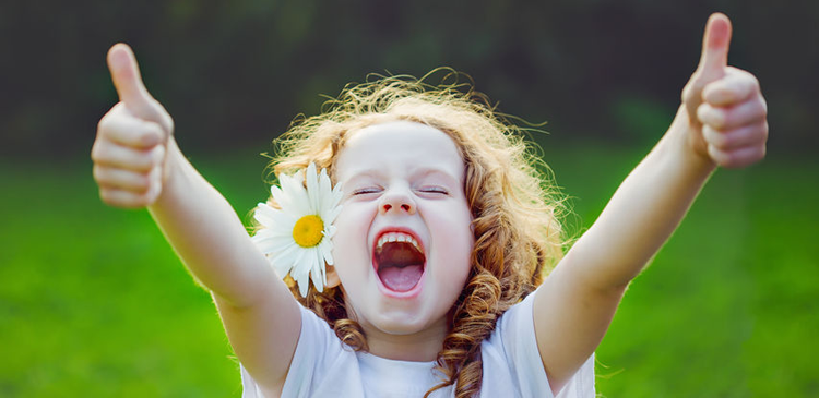 Excited girl with double thumbs up