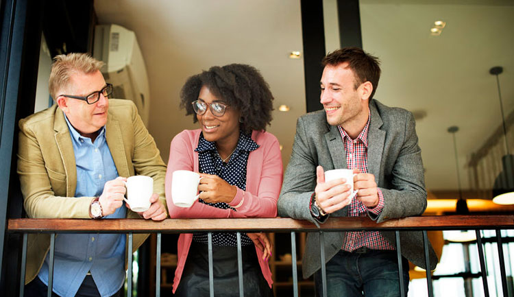 Three friends in conversation